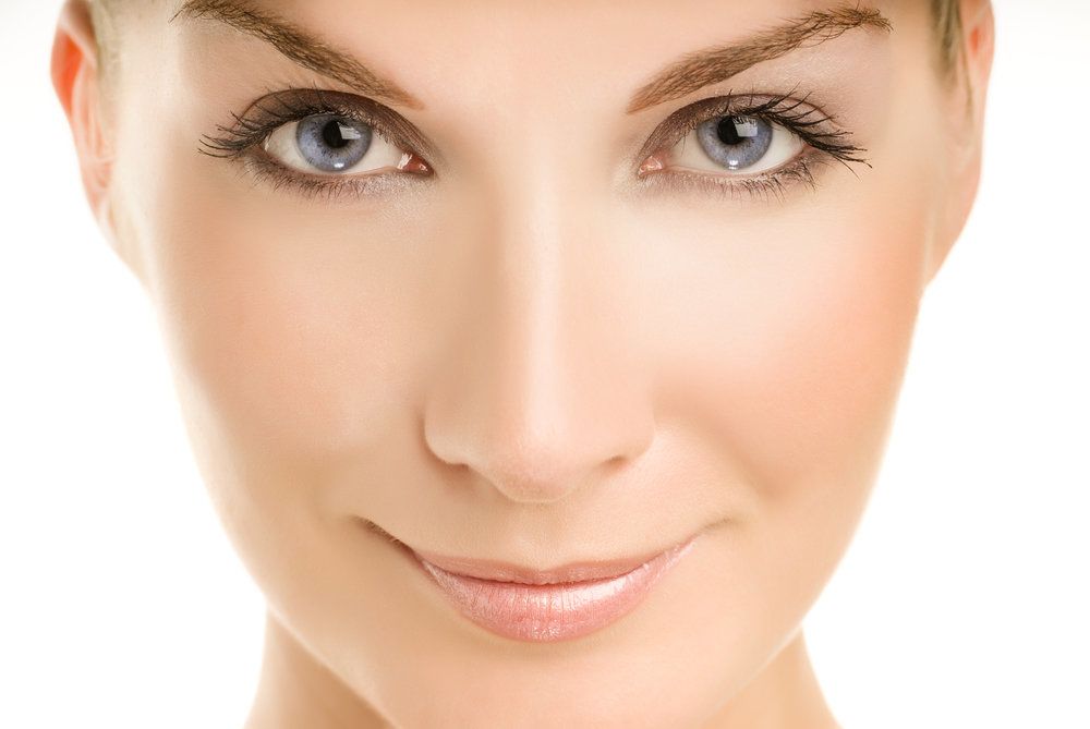 Close up photo of woman with blue eyes